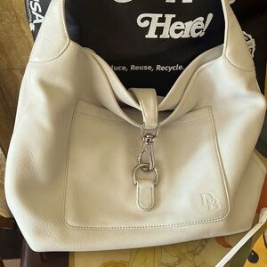 tumbled pebble grain leather with a luxe finish, is secured closure.